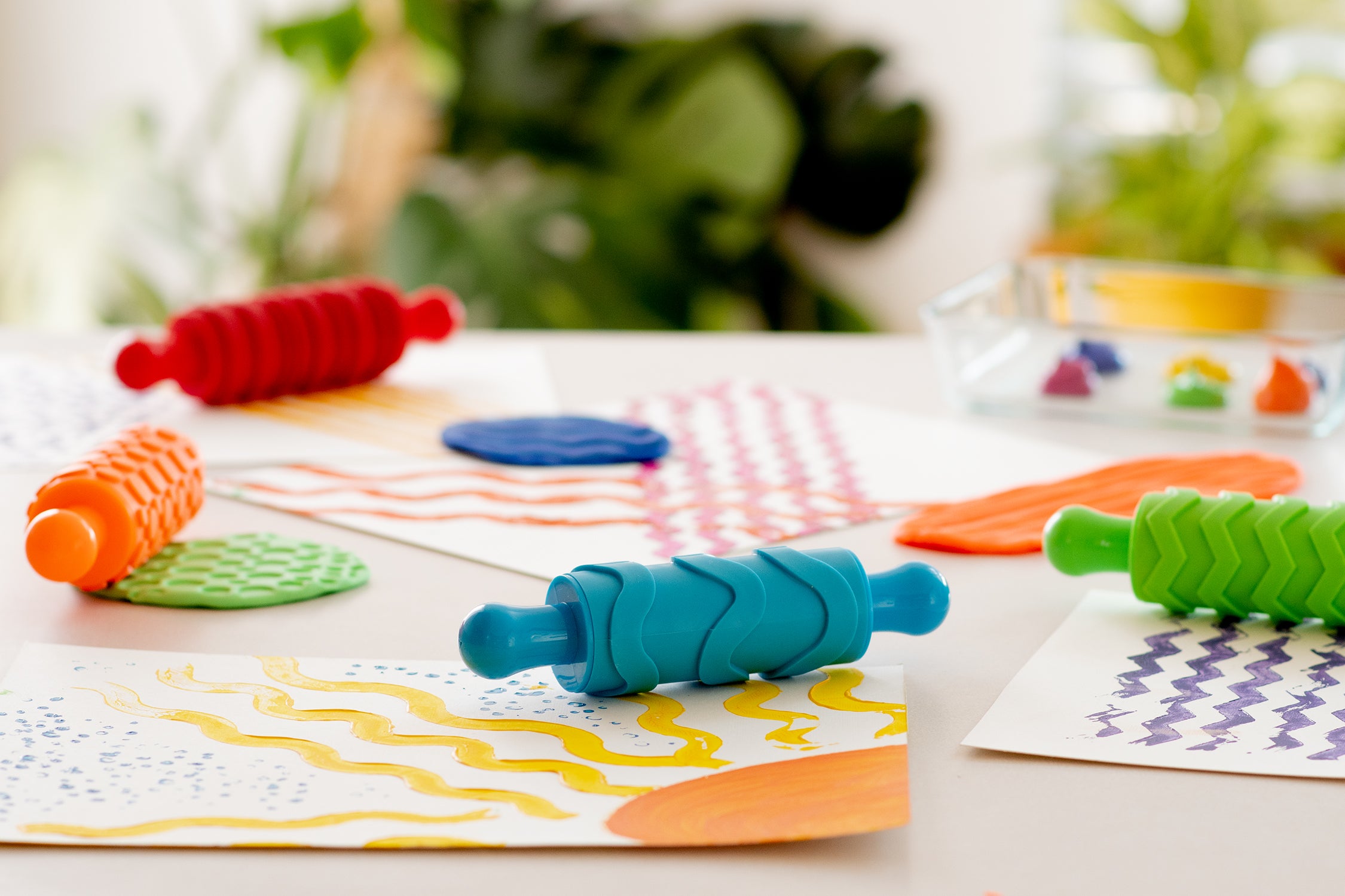 Colorful craft rollers and patterns made by kids